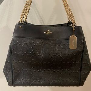 Coach black leather canvas shoulder bag.